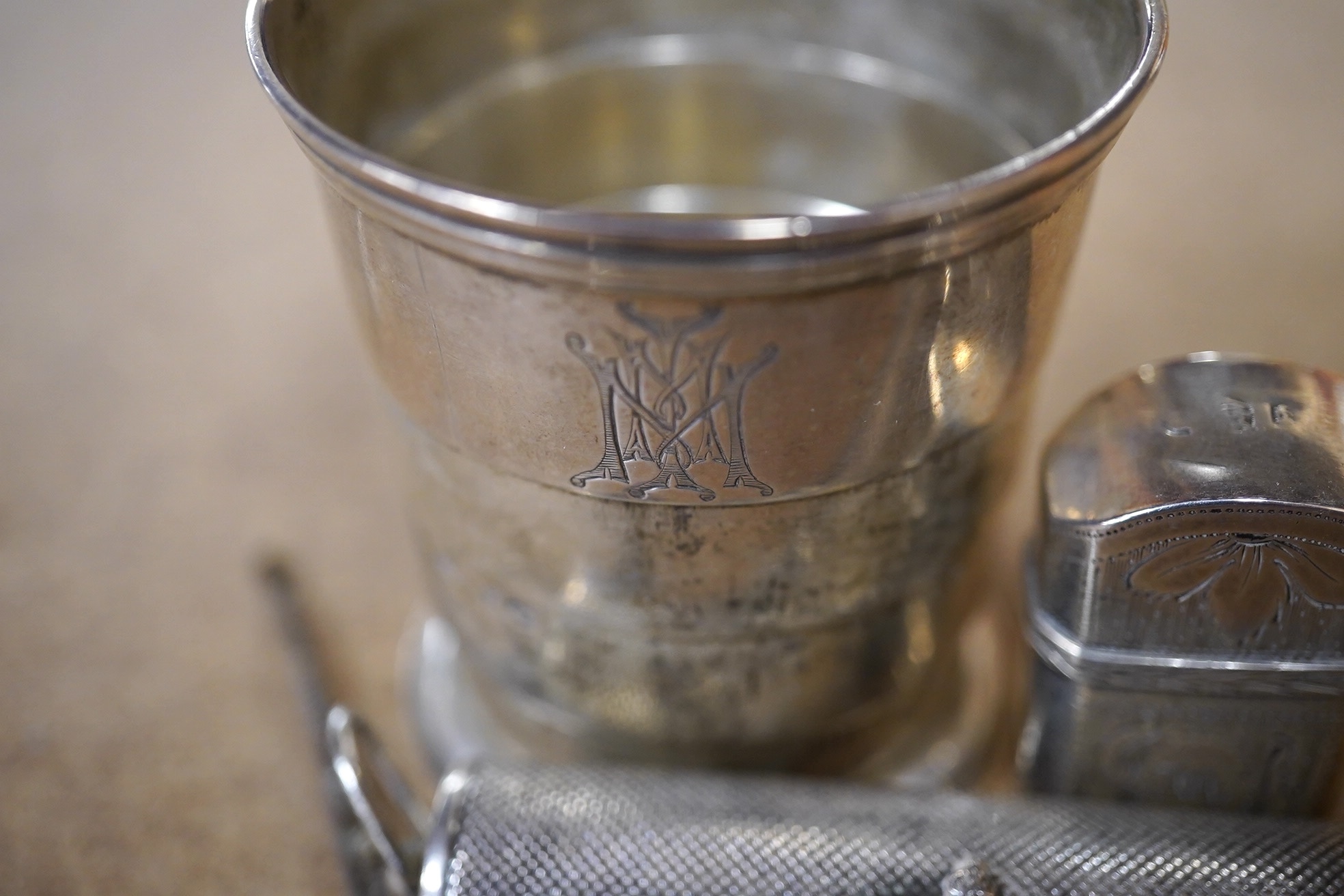 A George III engraved silver etui, Joseph Wilmore, Birmingham, 1808, a Victorian collapsible travelling cup, London, 1873, a snuff spoon and an RAF white metal mounted torch. Condition - fair to good